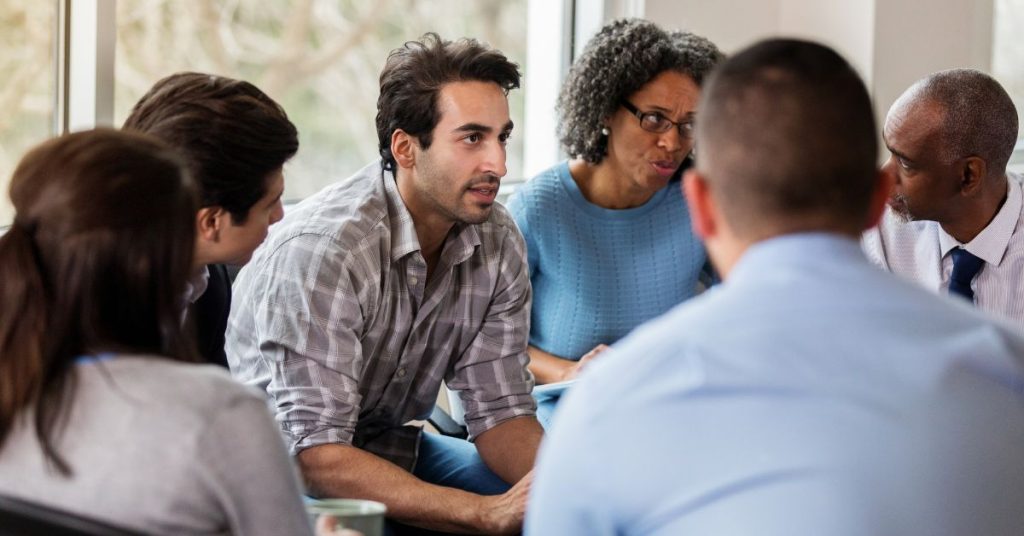 Senior adult struggling to hear conversations with a hearing aid