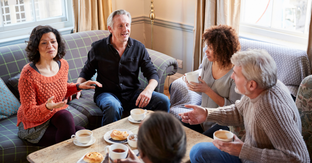 Person struggling to hear in a noisy environment like a restaurant