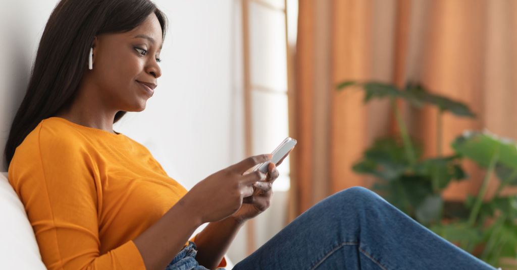 Person wearing earbuds with focus on ear health