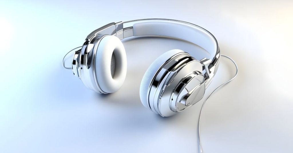 Person wearing headphones with potential risk of tinnitus