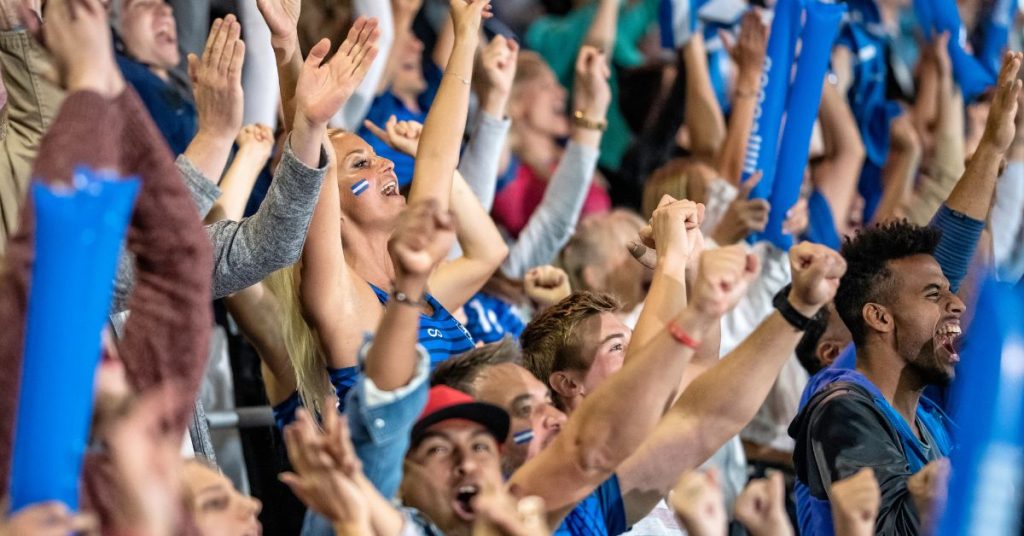 Fans wearing hearing protection at a loud sports event