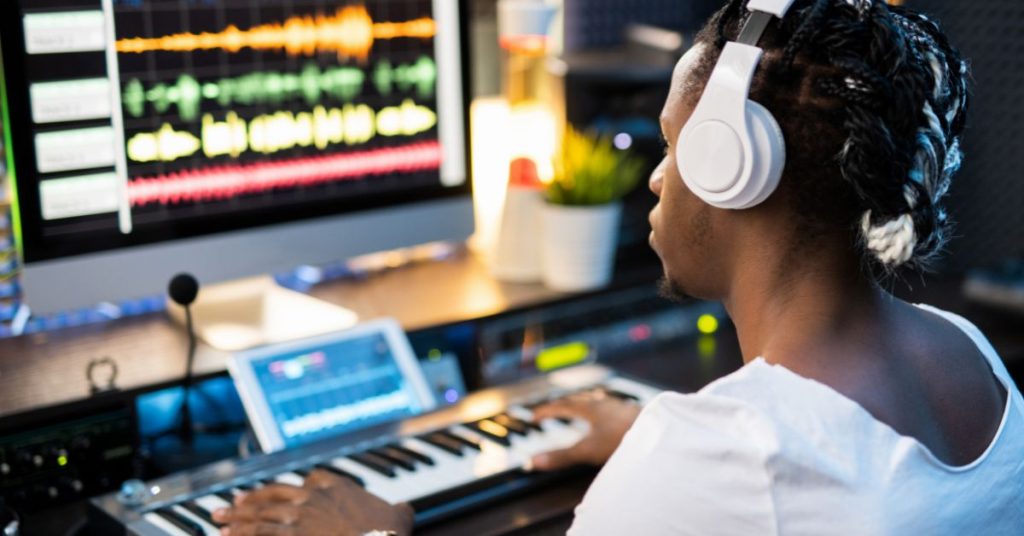 Musician using high-fidelity earplugs during a live performance