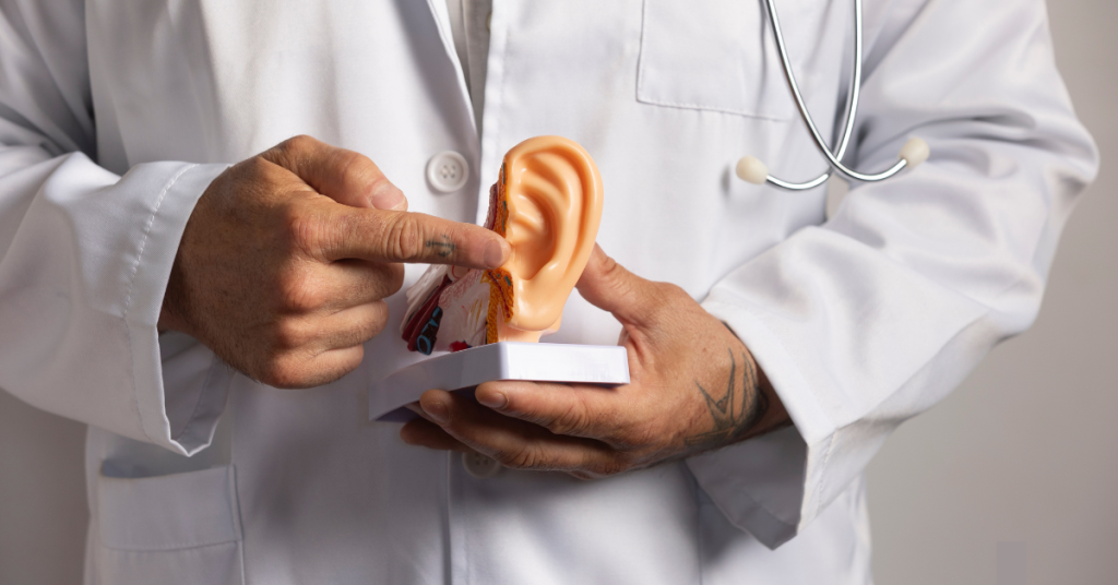Senior woman with hearing aids doing balance exercises at home