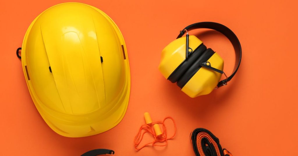 Worker using proper hearing protection in a loud workplace