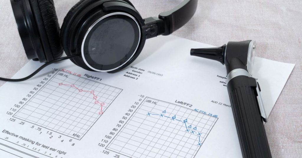 Audiologist conducting a pure tone audiometry test