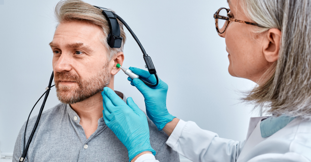 Tympanometry test being performed on a senior patient to assess ear health