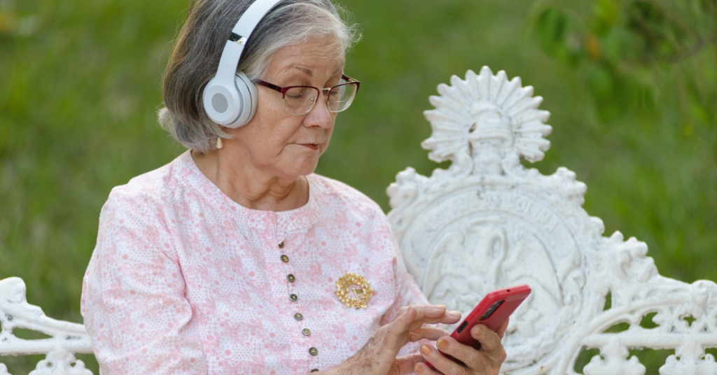 Older adult using an auditory training program on a tablet