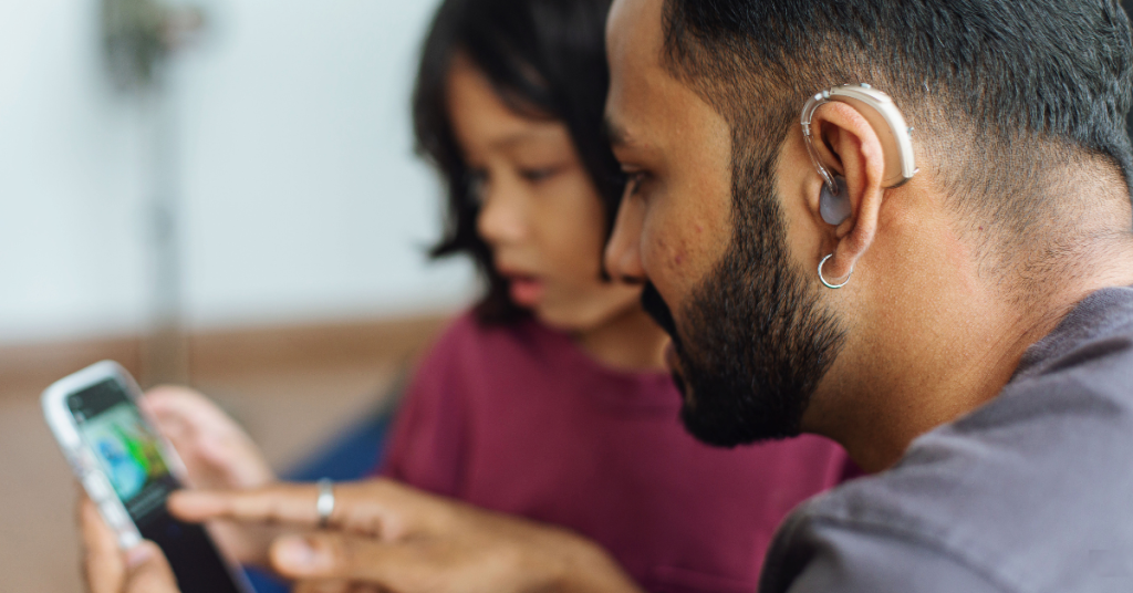 Social media post promoting hearing health awareness on a smartphone screen