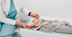 Patient undergoing an ABR hearing test with electrodes attached