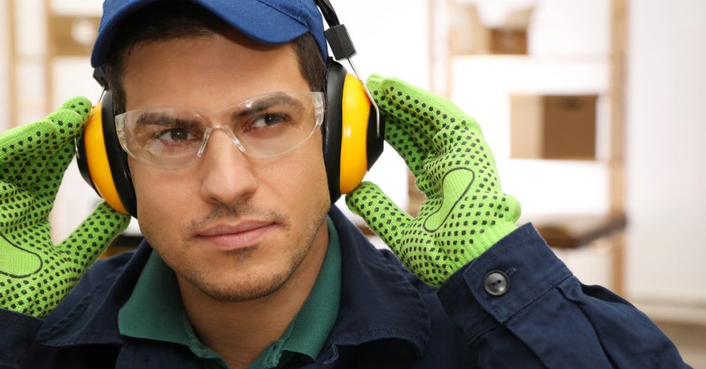 Employees using hearing protection in a workplace