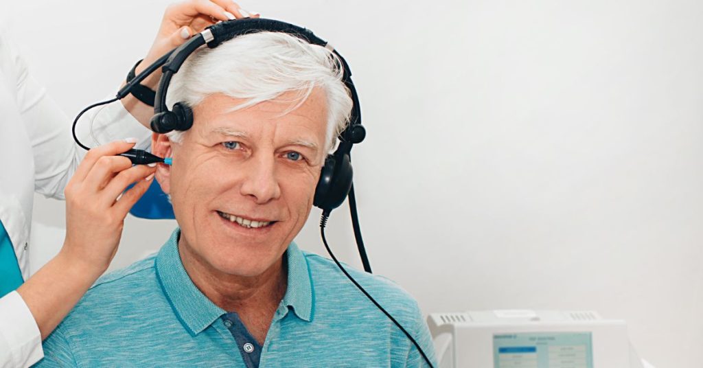 Auditory brainstem response test being performed by an audiologist