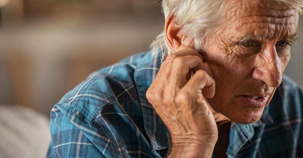 Blocked ear causing sudden muffled hearing in an older adult