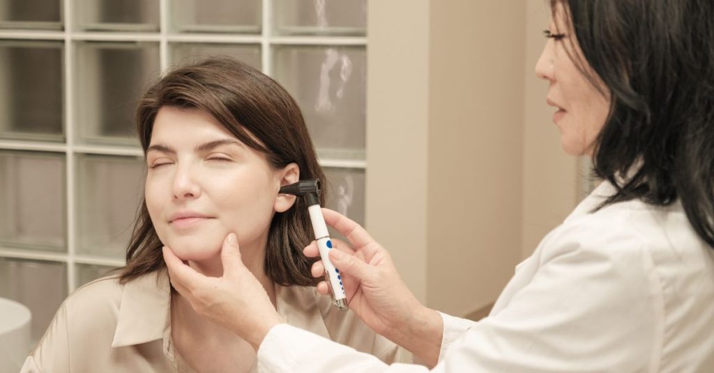 ENT and audiologist examining a patient’s hearing
