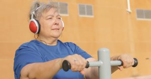 Senior adult undergoing hearing therapy with a specialist