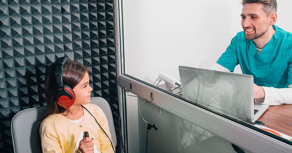 Child undergoing a hearing test at a pediatric clinic