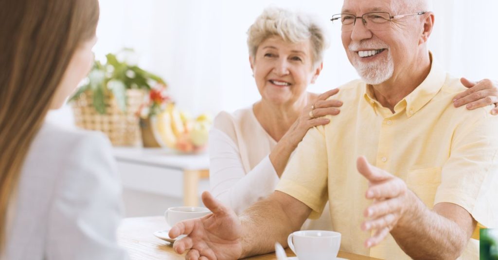 Senior reviewing hearing aid coverage with insurance paperwork
