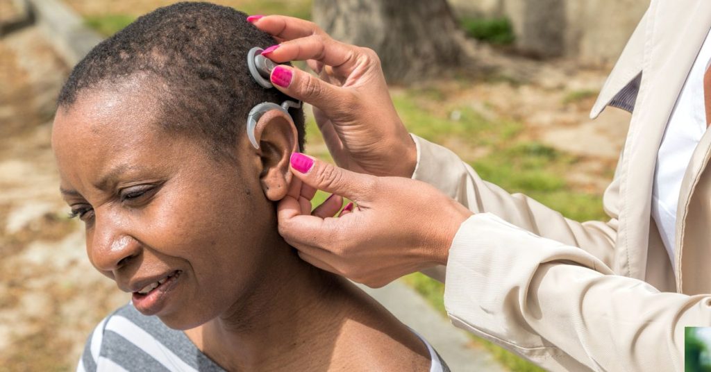 Illustration of how a cochlear implant works with internal and external components