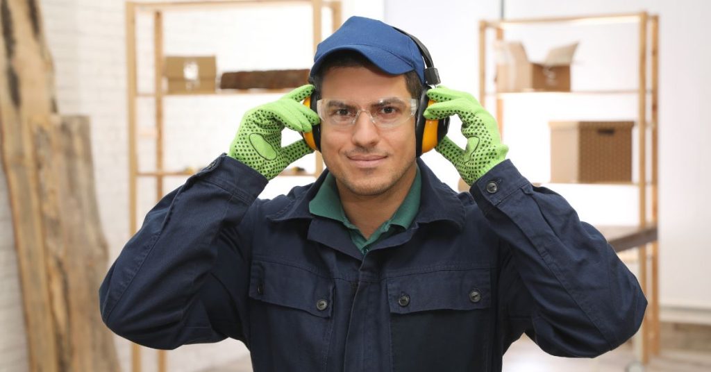 Person using hearing protection to reduce noise exposure