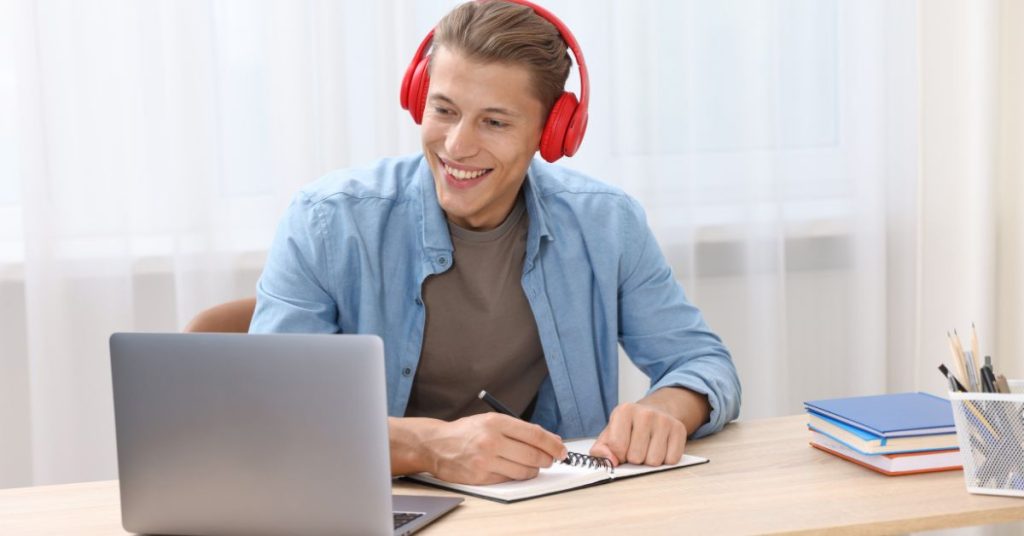 Person taking an online hearing test at home with headphones