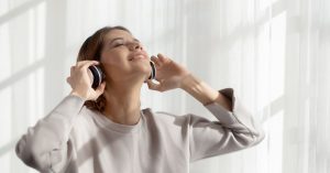 Person using sound therapy for tinnitus relief
