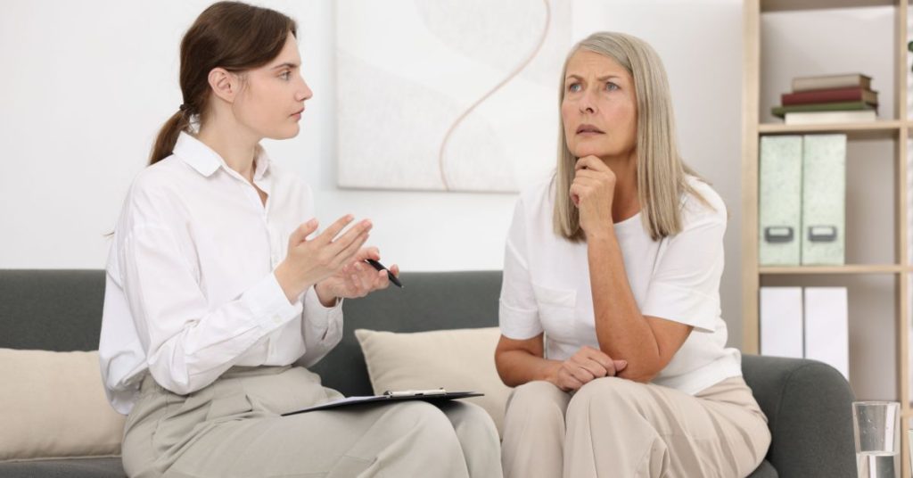 Speech therapy session helping an adult with hearing loss communicate confidently
