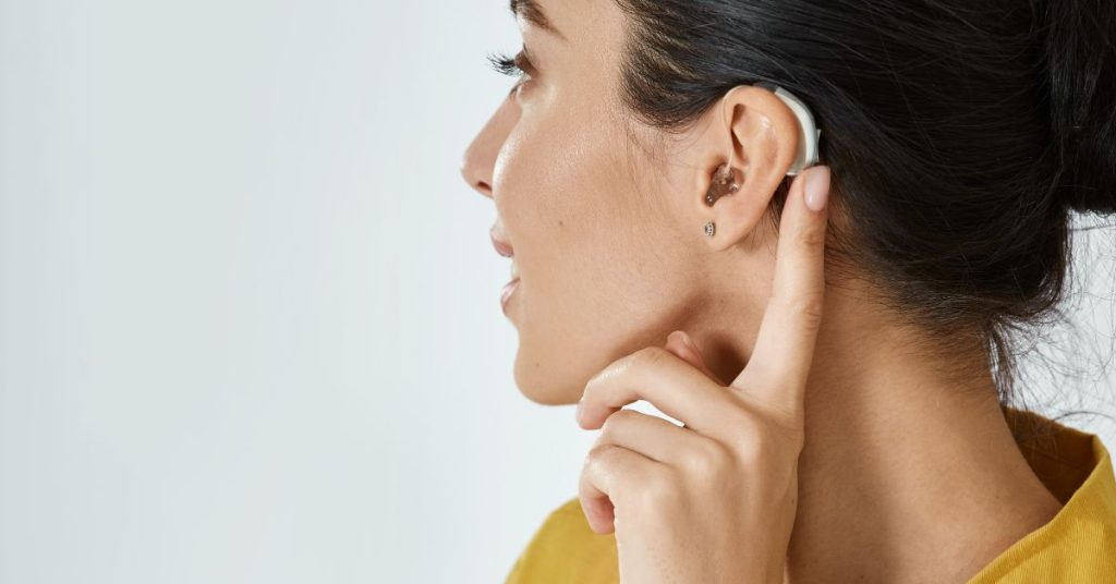 Adult receiving hearing checkup to prevent hearing loss